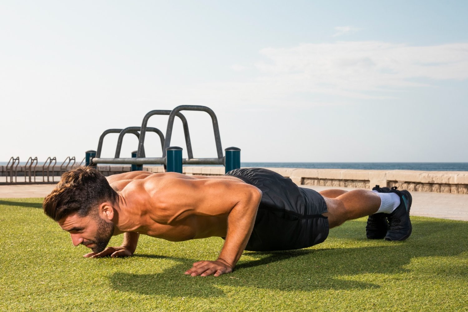 young-man-training-exercise-pushups