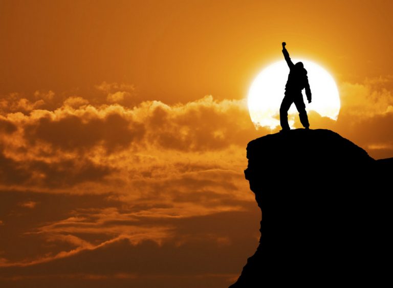 Man on top of mountain