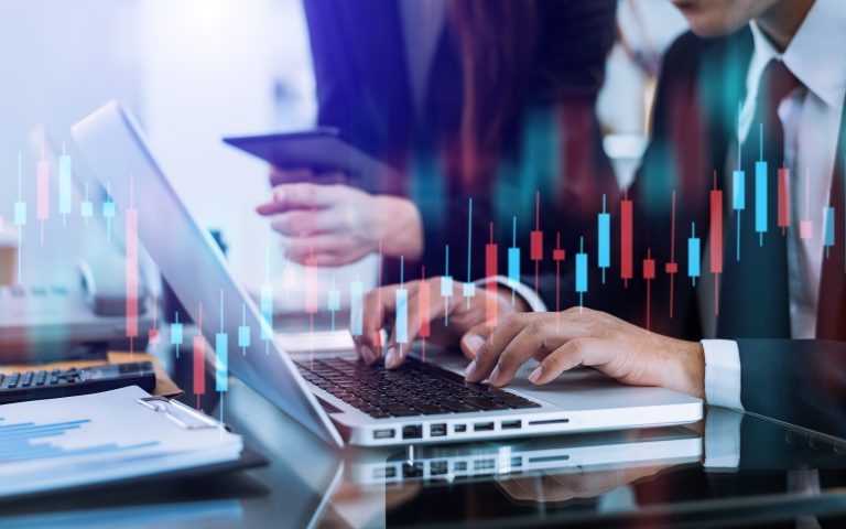 Two stock traiders making analysis of digital market and investm