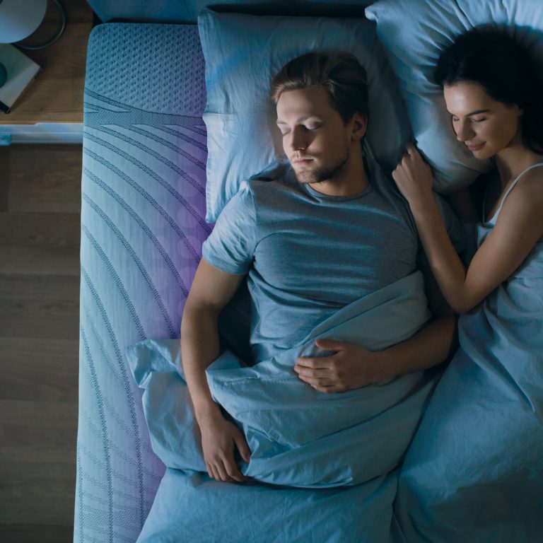 Top View Bed at Night: Attractive young Couple Sleeping Together