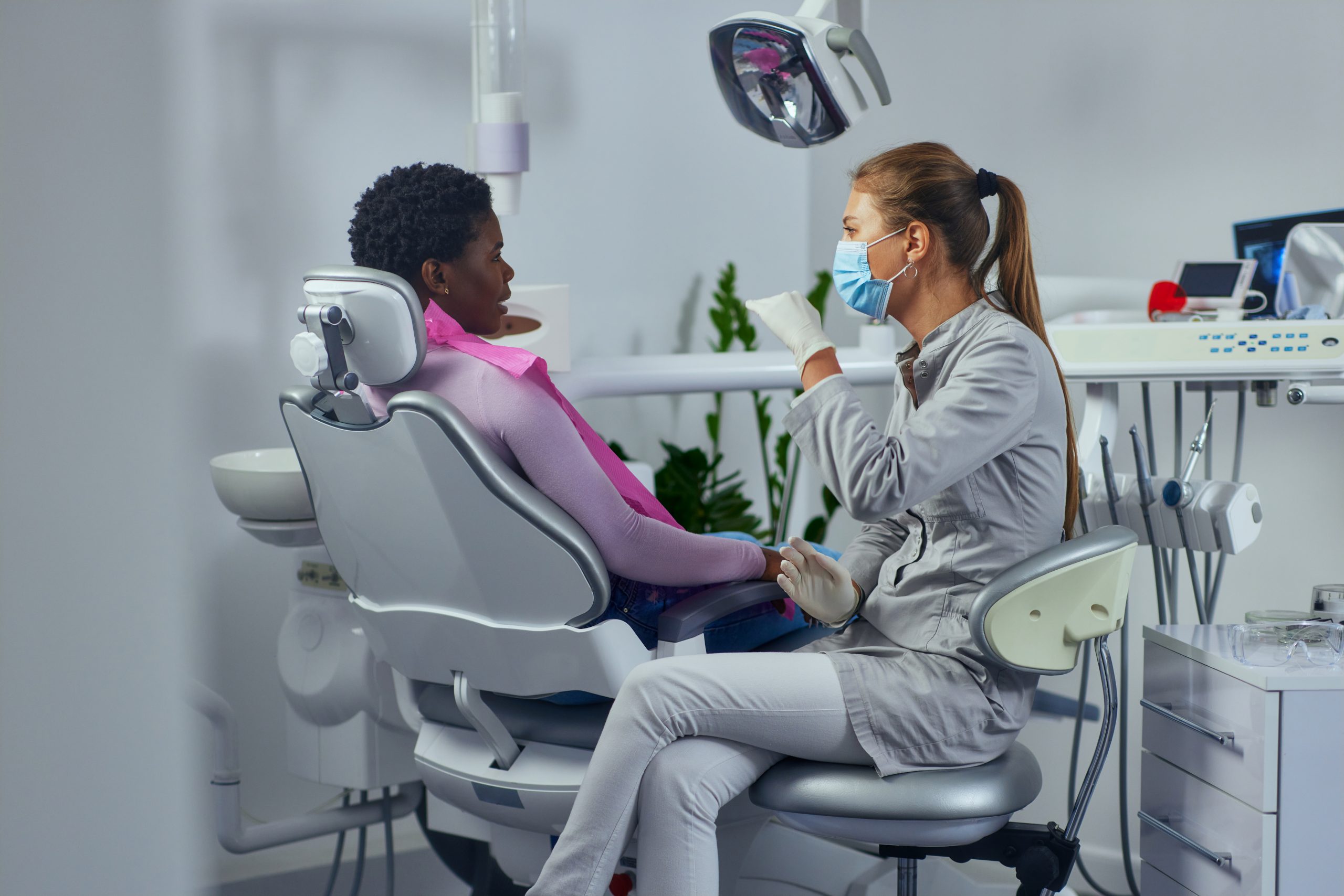 Dentist and african patient at clinic