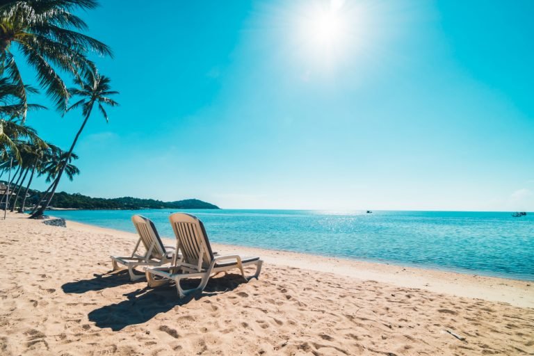 beautiful-tropical-beach-sea-with-chair-blue-sky