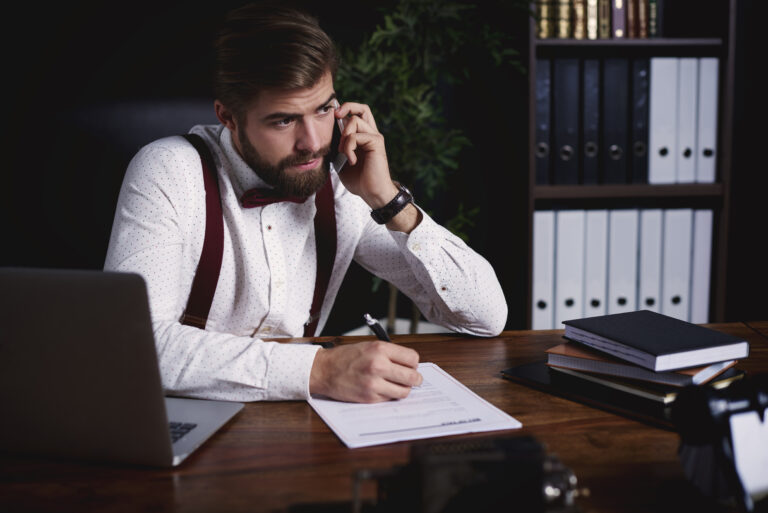 Business person talking by phone
